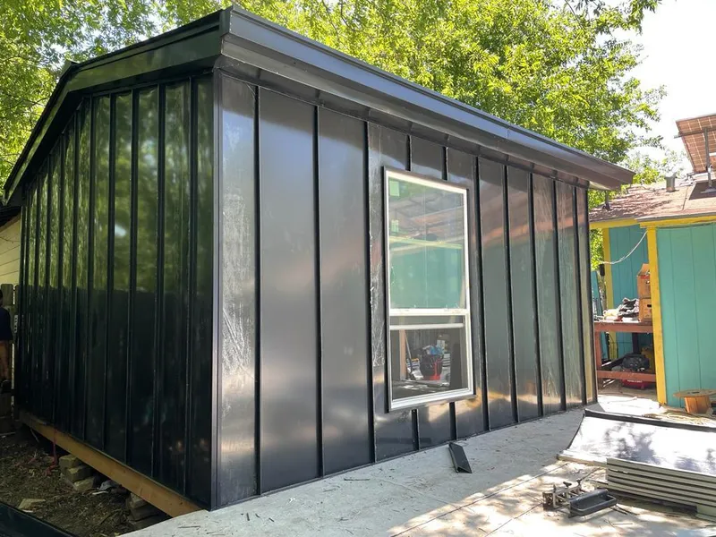 Black standing seam metal wall panels for Metal Roof Installation in Marquette