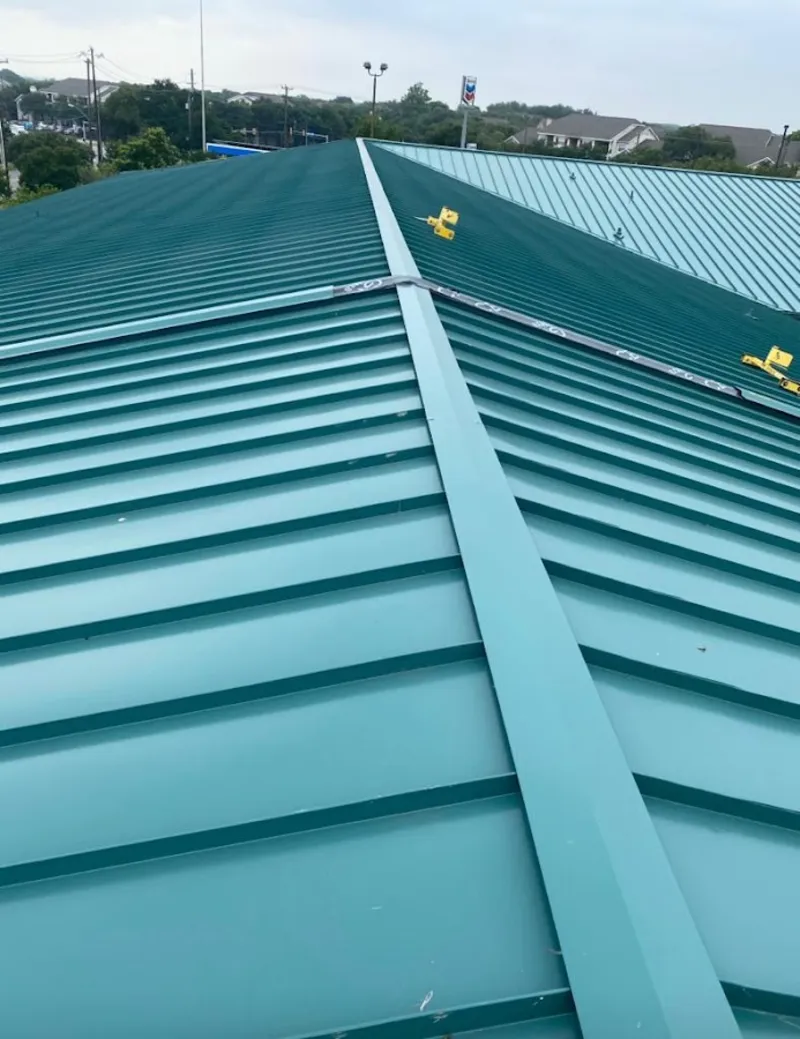 Green commercial metal roof ridge and valley for Metal Roof Repair in Marquette