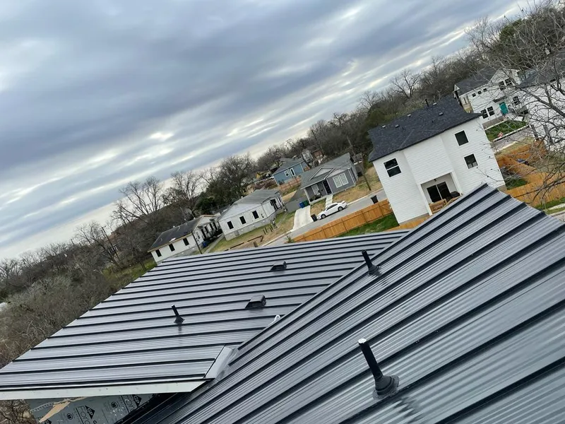 Standing seam metal roof panels with vents for Skylight Repair in Marquette